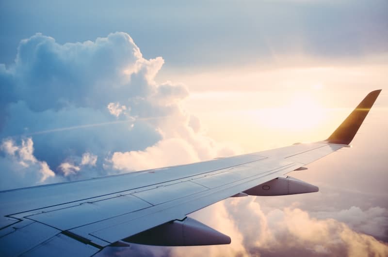 Commercial airplane flying through clouds